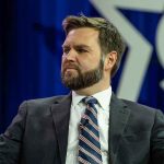 VP Vance Confirms: US Troops Stay Home Man in a suit with a thoughtful expression