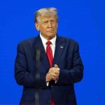 Trump’s Terrorism Order Shuts Down Antifa Hub Man in a suit with a blue background