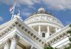 CAPITOL CHAOS: GOP Rep Under Fire Capitol building dome and flags under a blue sky