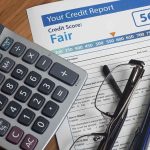 100 Million Americans to LOSE Credit Protection Calculator and glasses on credit report document