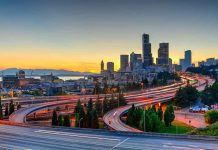 City skyline with highways at sunset