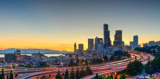 City skyline with highways at sunset