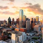 City skyline at sunset with modern skyscrapers