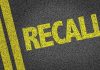 Vehicle Recall Nightmare: Millions Left in Limbo Yellow RECALL text on asphalt background
