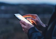 Person using a smartphone at dusk