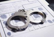Mother CONFESSES To Horrifying Penn Station Crime Handcuffs on fingerprint form with fingerprints visible