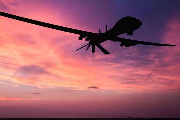 690489076 Silhouette of a drone against a colorful sunset