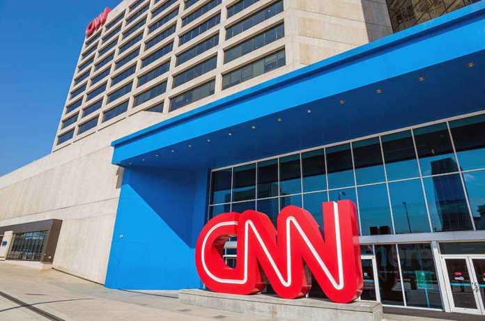 shutterstock_209605099.jpg Exterior view of the CNN headquarters with a large red logo and blue entrance