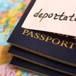 ICE BLASTS Violent Killer Out of U.S.—Finally! Stack of passports with a note labeled deportation on top placed on a map