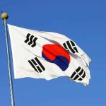 Nuclear Tech Sharing: Is US Security at Risk? South Korean flag waving against a clear blue sky