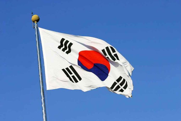 shutterstock_46451284.jpg South Korean flag waving against a clear blue sky