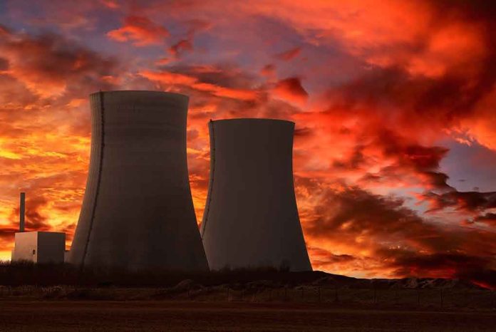 shutterstock_73078270.jpg Silhouette of cooling towers against a vibrant sunset sky