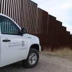 US-Mexico Tensions SPIKE Over Border Actions Border protection vehicle near a large metal fence