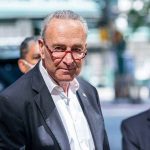 Democratic Party in TURMOIL Over Shutdown Deal Chuck Schumer posing for camera.