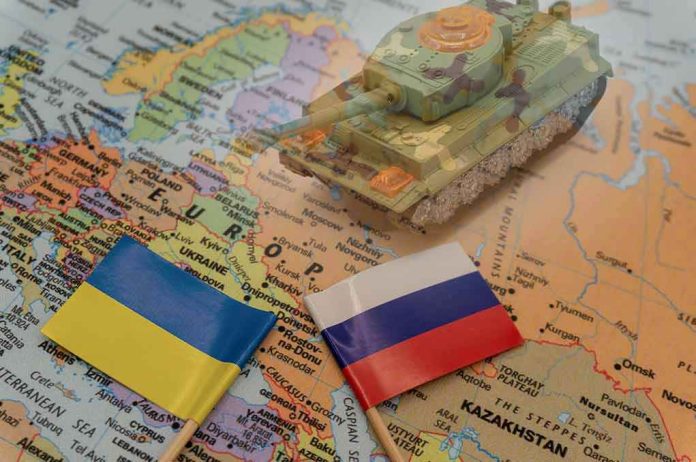 Toy tank on map with Ukraine and Russia flags.