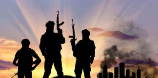 Cartels Designated TERRORISTS – Trump Moves Fast Three armed silhouettes near a smoky city skyline.