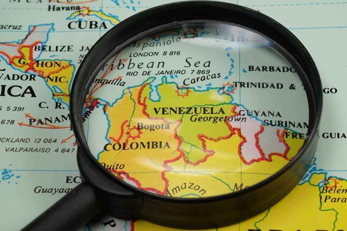 Magnifying glass focusing on Venezuela and Colombia on map