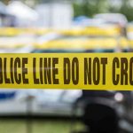 Homeowner CHARGED After Killing Teenage Burglar Yellow police line tape with Do Not Cross.