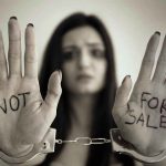ICE ARREST Turns Into Media Manipulation Handcuffed woman shows NOT FOR SALE on her palms.
