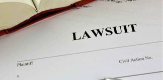 Lawsuit document with a pen and book