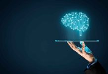 AI Song Shocks Country Music World Hand holding tablet projecting digital brain hologram.