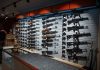 Wall-mounted guns displayed in a store.