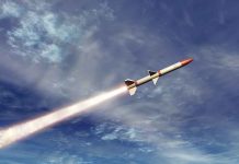 A missile ascending into the sky with a trail of smoke