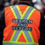 Search Volunteers Find What Police Couldn’t Person wearing a bright orange search and rescue vest