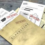 Horrifying Epstein Lair Photos Drop Classified documents with Top Secret stamps on wooden surface.