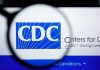 CDC Panel QUIETLY Kills Newborn Vaccine Rule CDC logo magnified on a screen.