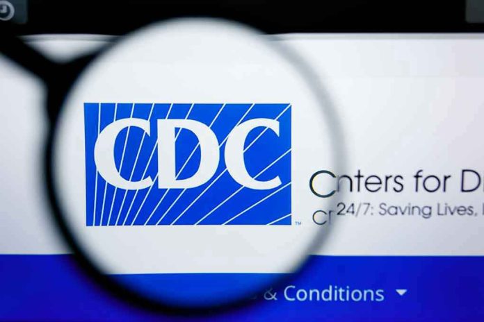 1450445633 CDC logo magnified on a screen.