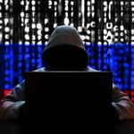 Luxury Cars HIJACKED—Owners Completely Helpless Hacker in hoodie with Russian flag background and code.
