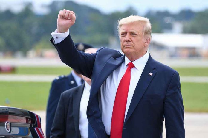 Man in suit raising fist near parked car.