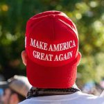 High-Profile MAGA Alliance Fractured Person wearing a red Make America Great Again hat.