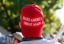 High-Profile MAGA Alliance Fractured Person wearing a red Make America Great Again hat.