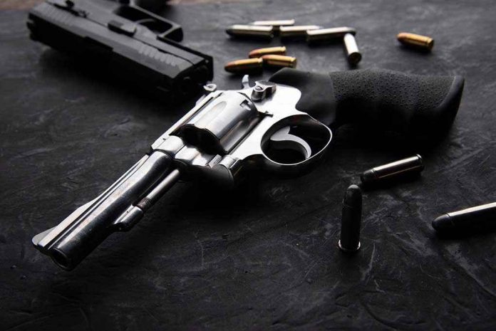 Revolvers and bullets on a dark surface.