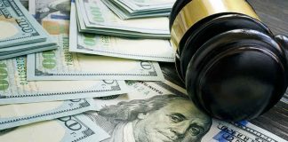 Farmers Caught in Tariff Crossfire! Gavel and hundred dollar bills on table.