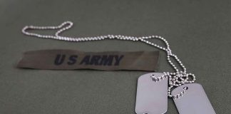 Dog tags and US Army patch on uniform