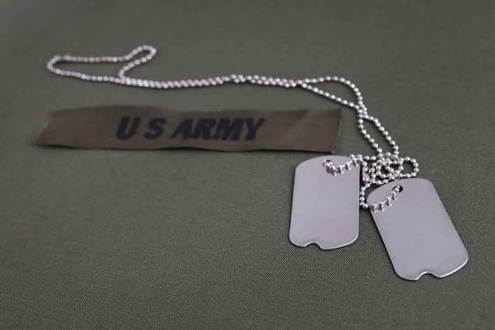 2418520321 Dog tags and US Army patch on uniform
