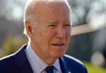 Did Biden FBI Buried Pipe Bomb Leads? Elderly man in suit outside in daylight.