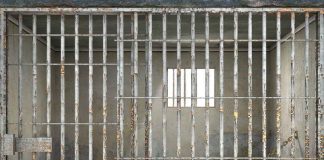 27 Years Lost—Wrongful Conviction Nightmare Ends Empty rusty prison cell with a small window.