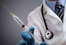 Florida BOMBSHELL: Top Doctors Dragged Into Court A doctor holding a syringe with a stethoscope around their neck