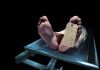 6000 Autopsies Revealed What Actually Kills People Feet of a deceased person on a coroners table with an identification tag