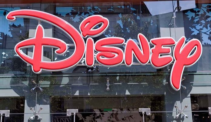 shutterstock_219993751.jpg Bright red Disney logo displayed on a storefront window