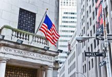 Wall Street Boss ACCIDENTALLY Admits Buying Congress Facade of the New York Stock Exchange with an American flag and Wall Street sign