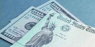 $100 bill and U.S. Treasury check.