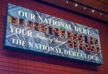 U.S. National Debt Clock displaying current debt figures.