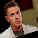 CBS Executives EXPOSED! Person on laptop screen during an interview.