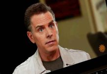 CBS Executives EXPOSED! Person on laptop screen during an interview.