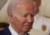 Biden’s Most Catastrophic Failure Man in a suit looking thoughtful.